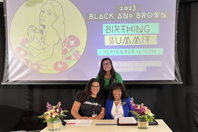 Thuba posing with legislators at the Black & Brown Birthing Summit.